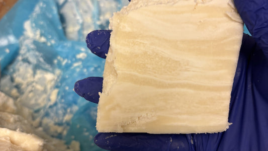 Raw shea butter held in our workshop before being weighed for a small batch.
