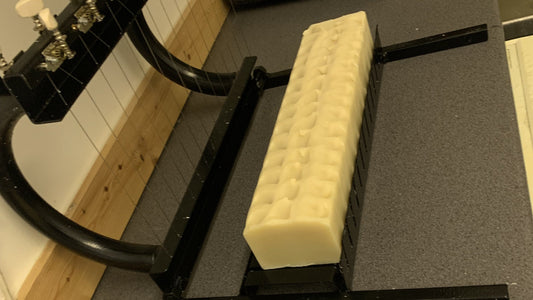 Image showing a soap multi cutter and fresh soap loaves waiting to be cut in Damn Fyne Soap's workshop.