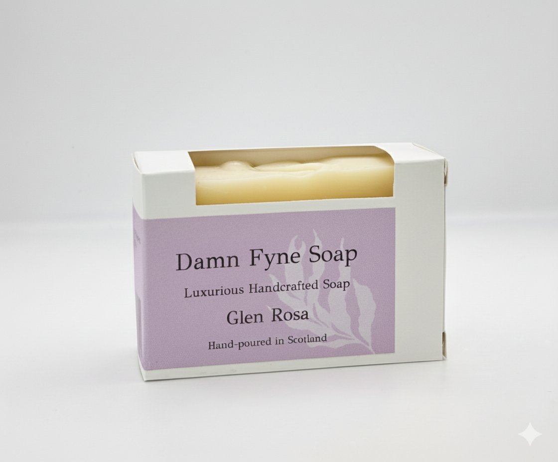 Glen Rosa handmade soap bar in biodegradable kraft packaging with a soft pink label. Label reads “Damn Fyne Soap – Luxurious Handcrafted Soap – Glen Rosa – Hand-poured in Scotland.” Pale-toned soap visible above the box, photographed on a neutral background.