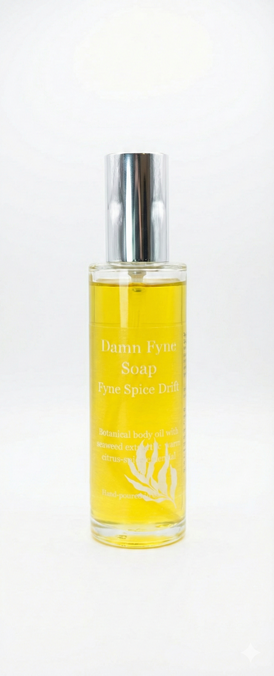 Fyne Spice Drift Body Oil bottle with warm citrus-spice essential oils and seaweed extract. Luxury body oil.