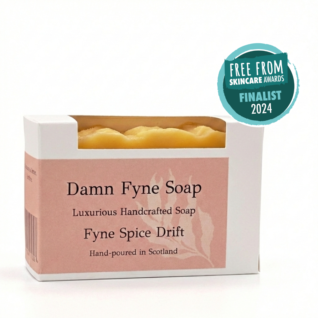 Box of Damn Fyne Soap with 'Fyne Spice Drift' scent, featuring a Free From Skincare Awards Finalist badge. patchouli, orange and pink pepper essential oils.