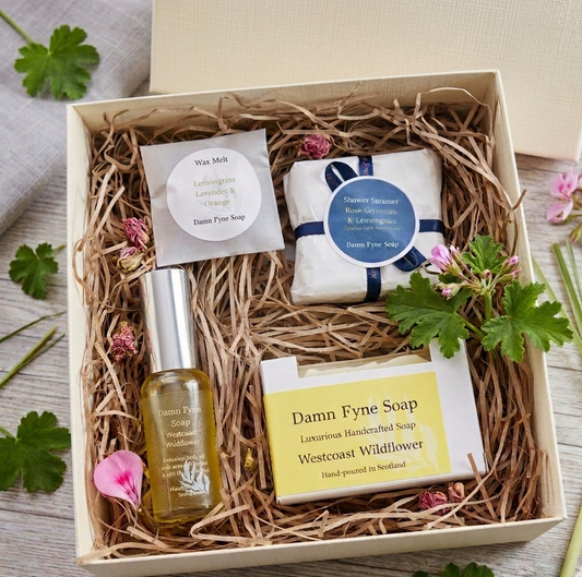 spa gift box with rose geranium and lemongrass essential oils. handmade soap, luxury body oil, wax melt and shower steamer.